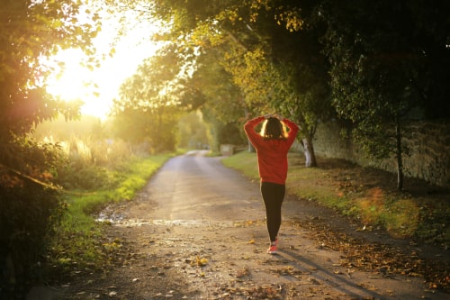 Woman walking and breathing to stay calm