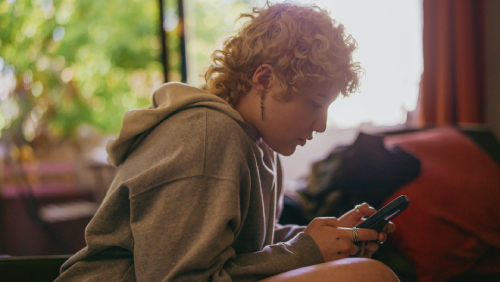 Girl with ADHD using her smartphone